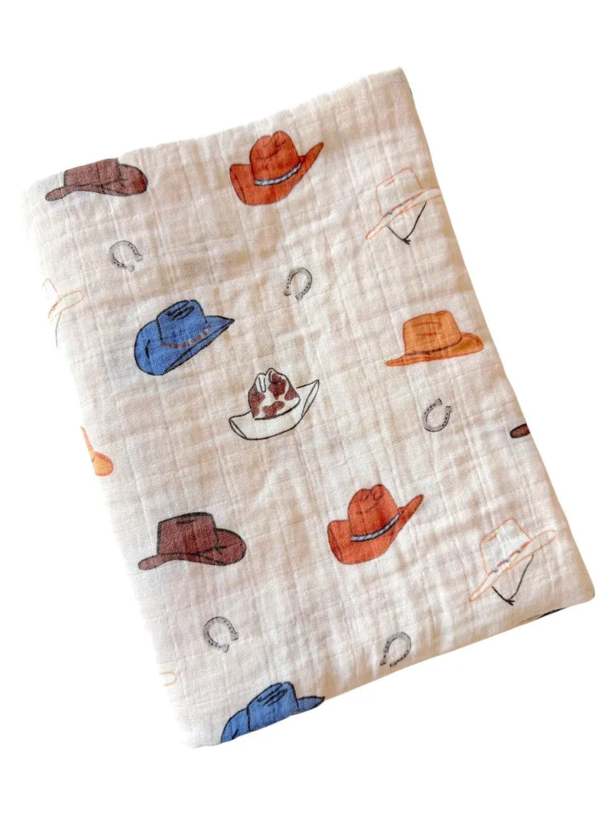 Folded fabric with cowboy hat pattern on a white background