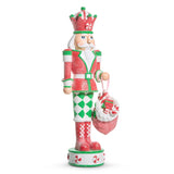 Decorative Christmas nutcracker figurine with red and green outfit on a white background