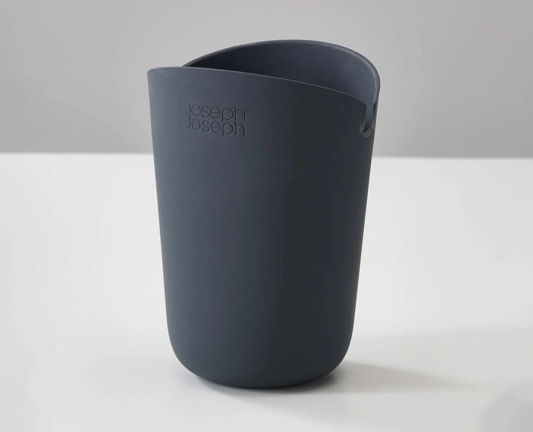 Dark gray cup with 'Joseph Joseph' branding on a white surface.