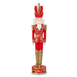 Decorative nutcracker figure in red and gold attire on a white background