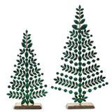 Two decorative Christmas trees made of green beads on a white background