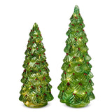 Two green ceramic Christmas trees with red berries on a white background