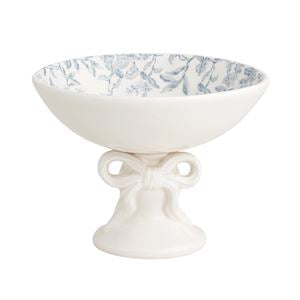 White ceramic footed bowl with blue floral pattern on a white background