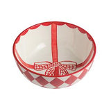 Decorative bowl with red checkered pattern and bow design on a white background
