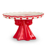 Red and white ceramic cake stand with scalloped edge on a white background