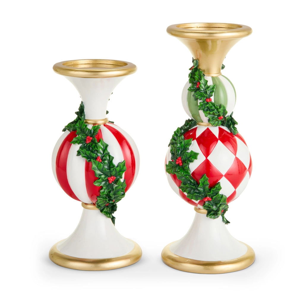 Two decorative candle holders with red and white patterns and gold bases on a white background
