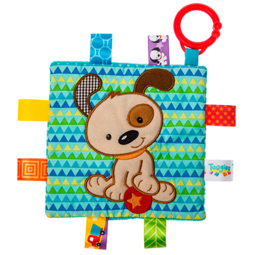 A multicolored baby security blanket with a deer pattern and tags around the edge.