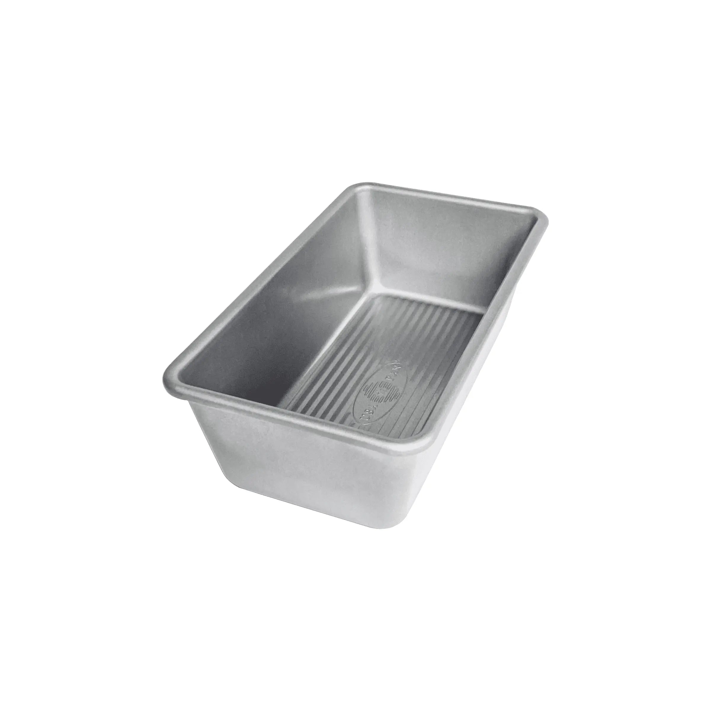 Metal loaf pan on a white background