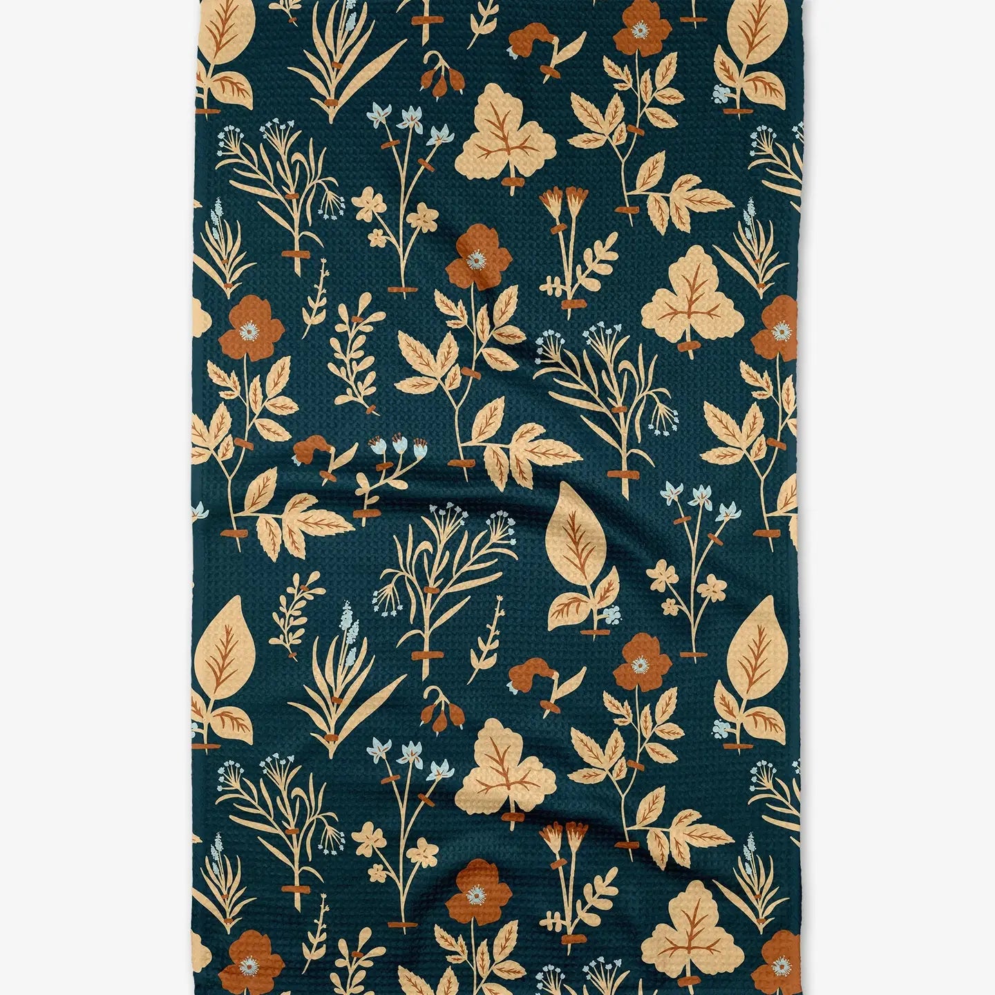 Floral patterned fabric with leaves and flowers on a dark blue background
