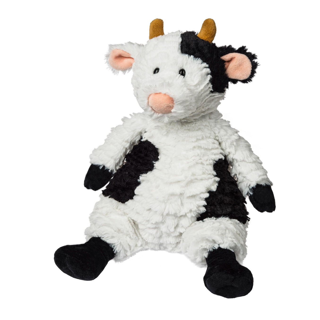 Plush cow toy with black and white pattern on a white background