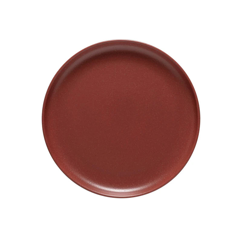 Round brown ceramic plate on a white background