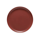 Round brown ceramic plate on a white background