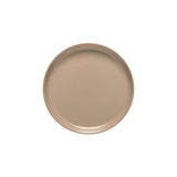 Beige ceramic plate on a white background