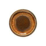 Round ceramic dish with brown glaze on a white background