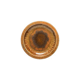 Round ceramic dish with brown glaze on a white background
