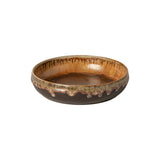 Ceramic bowl with brown glaze on a white background