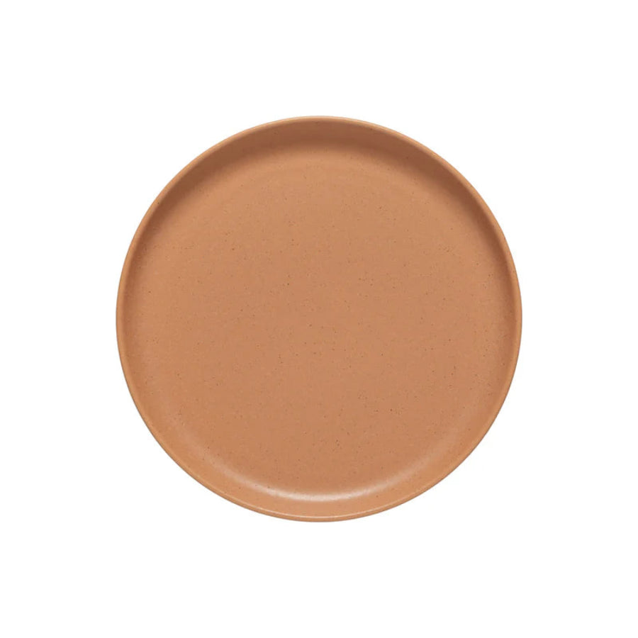 Ceramic plate with a brownish-orange color on a white background