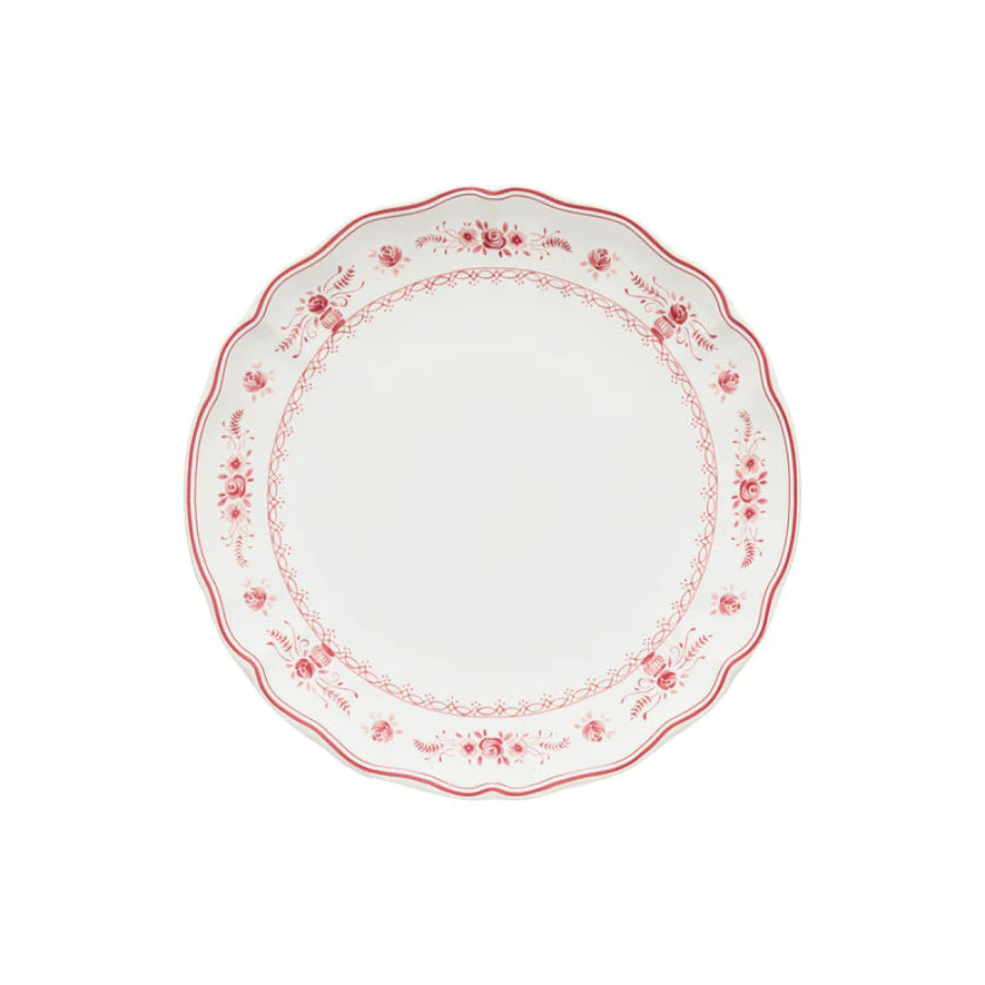 Decorative plate with red floral pattern on a white background