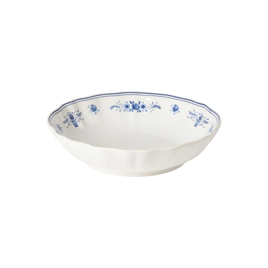 White ceramic bowl with blue floral patterns on a white background