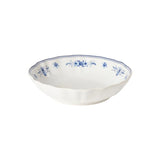 White ceramic bowl with blue floral patterns on a white background