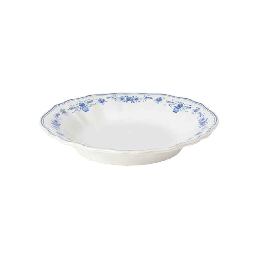 White ceramic bowl with blue floral patterns on a white background