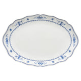 White ceramic platter with blue floral patterns on a white background