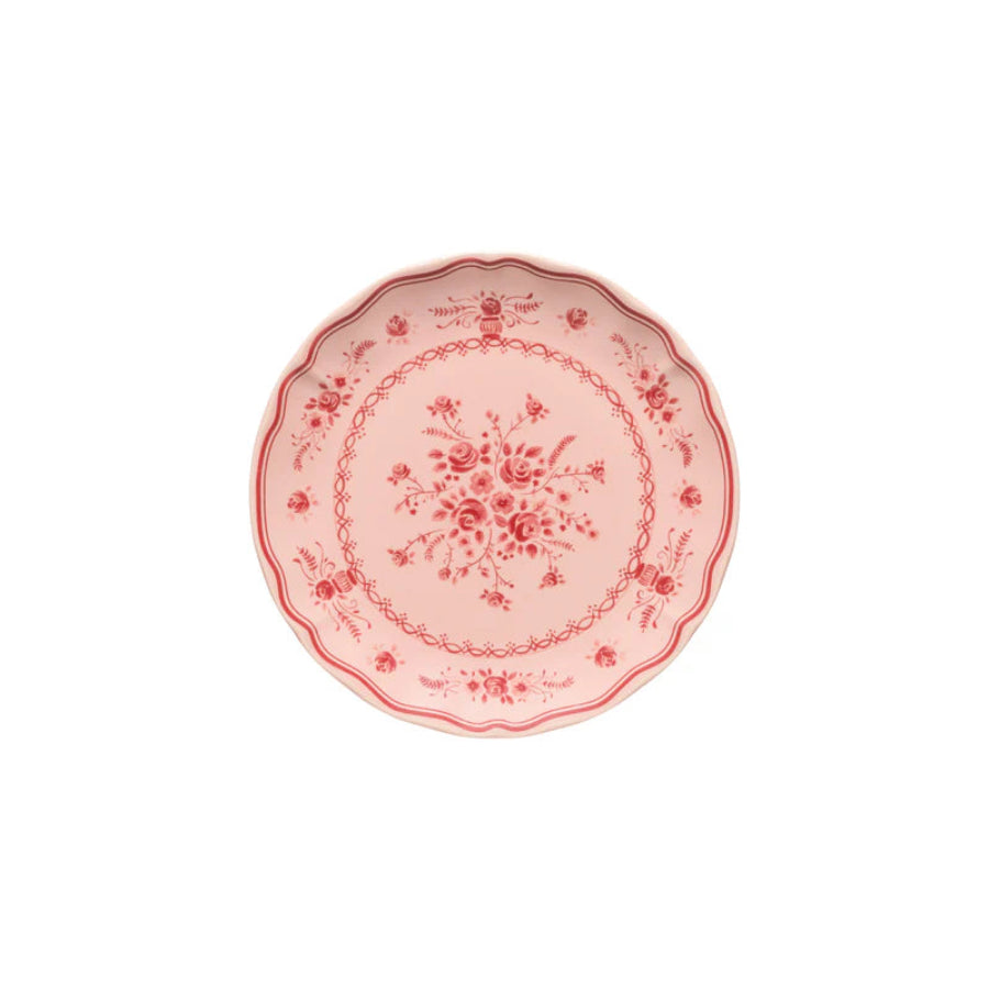Decorative pink plate with floral patterns on a white background