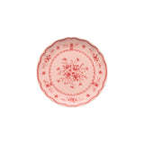 Decorative pink plate with floral patterns on a white background