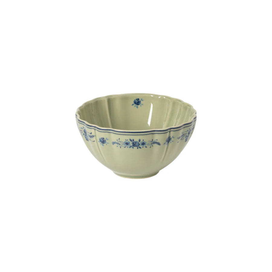 Decorative ceramic bowl with blue floral patterns on a white background