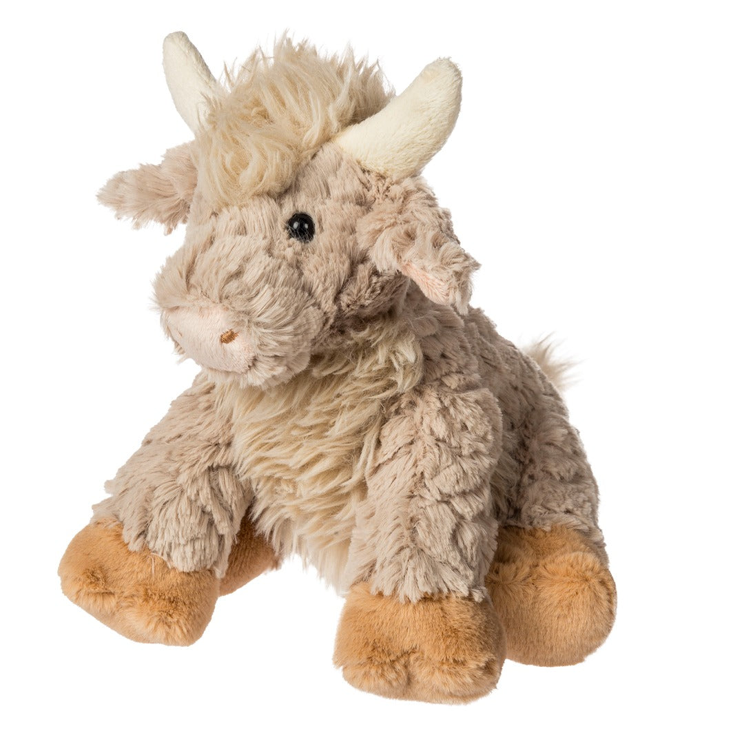 Plush toy cow on a white background