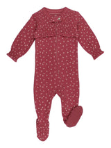 A baby footed sleeper in a dusty rose red color with a small white floral pattern, featuring long sleeves, a ruffled chest detail, and a front zipper.
