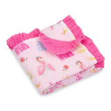 A folded baby blanket featuring a light pink background with a whimsical print of ballerina girls, roses, and gold accents, finished with bright pink ruffled trim.