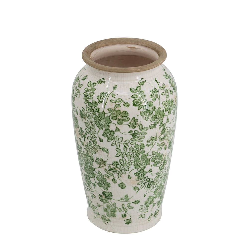 Ceramic vase with green floral pattern on a white background
