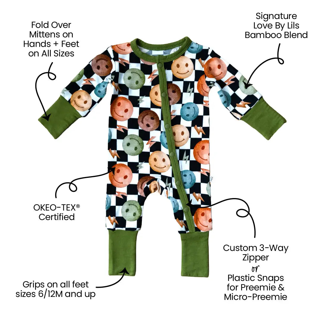 Baby onesie with checkered pattern and green accents, featuring text on product features.