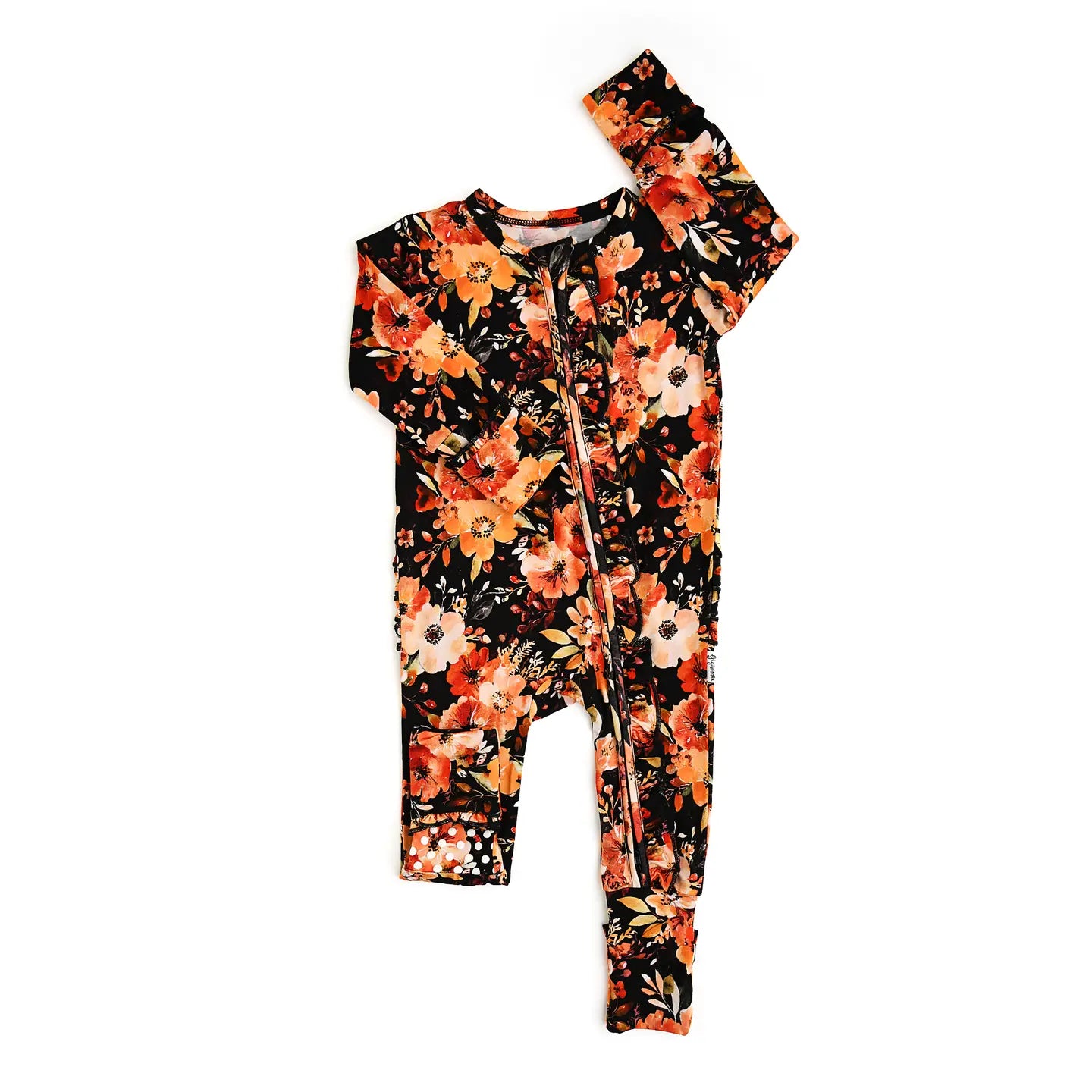 Floral-patterned baby romper with matching headband on a white background