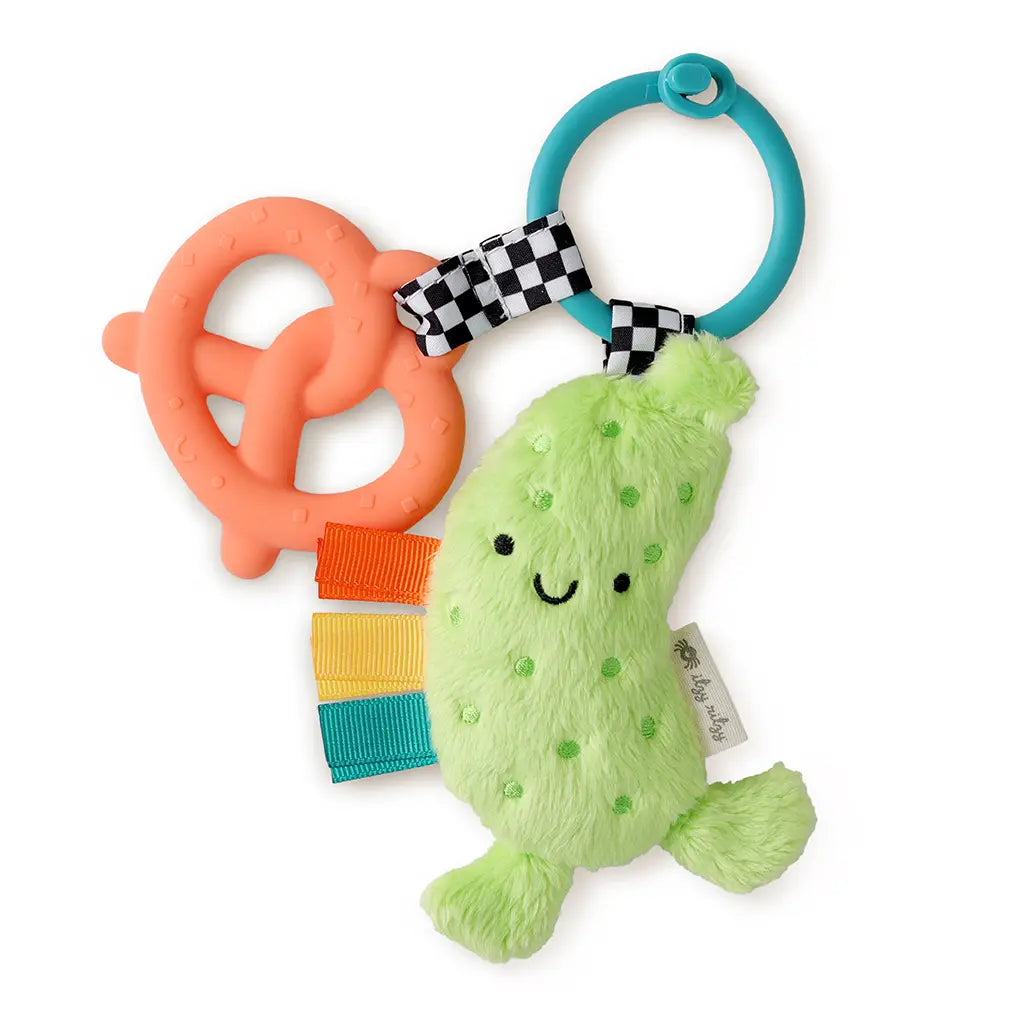 Colorful baby teething toy with a green plush toy and orange teether on a white background