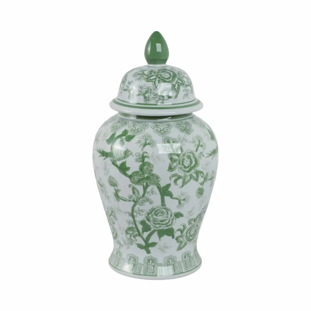 Decorative ceramic jar with green floral patterns on a white background
