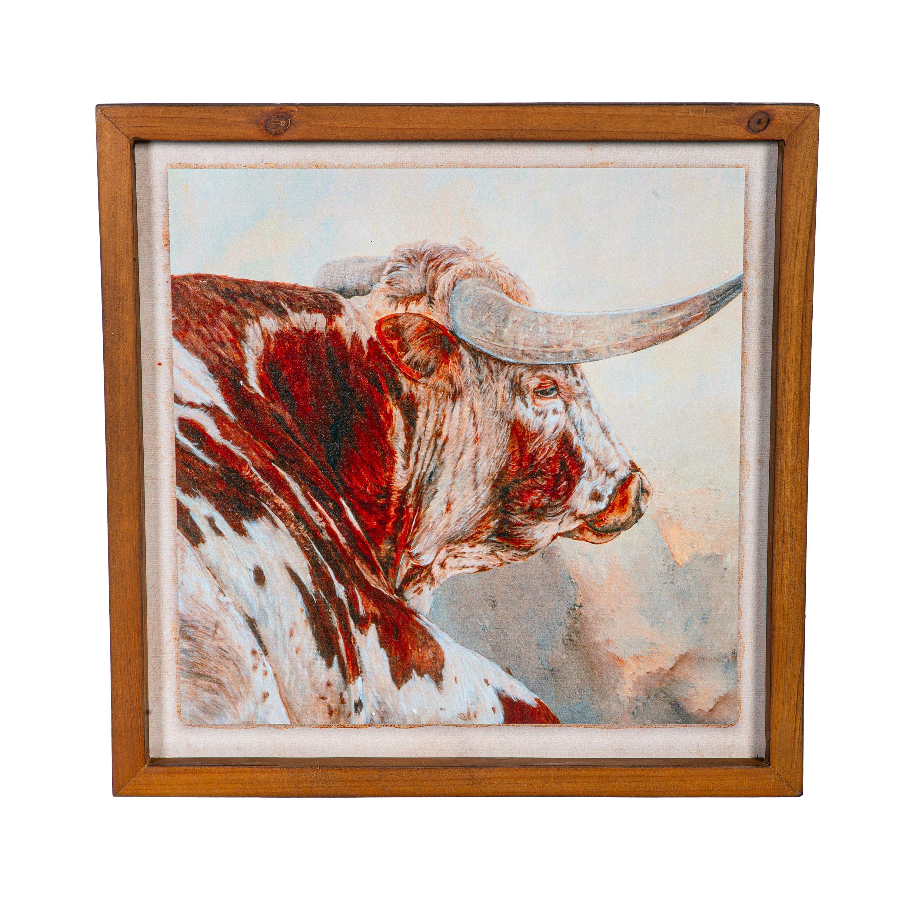 A framed painting of a longhorn steer's head on a white background, with a wooden frame.