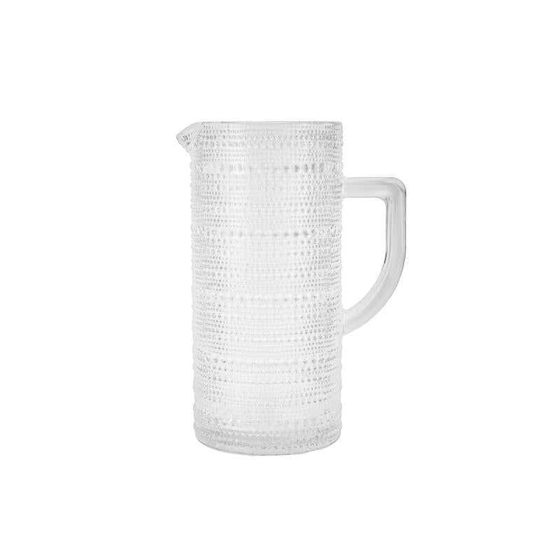 White textured pitcher on a white background