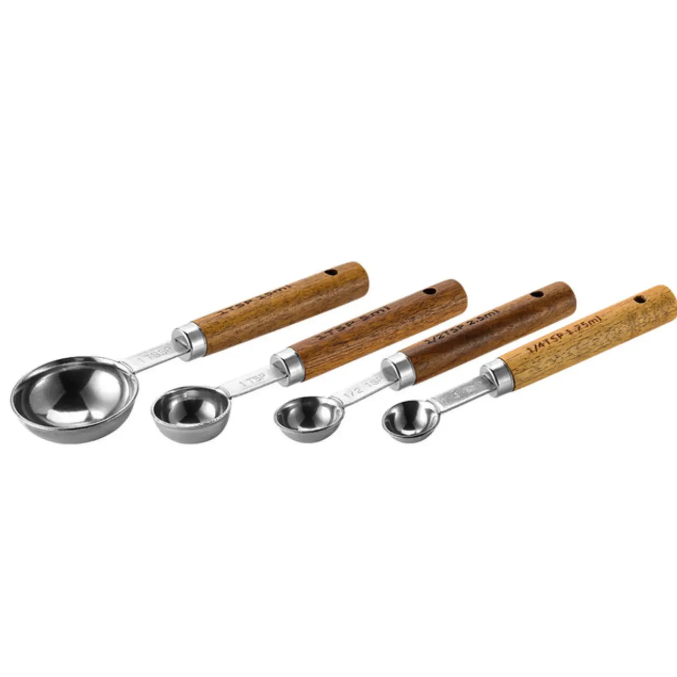 Set of four measuring spoons with wooden handles on a white background