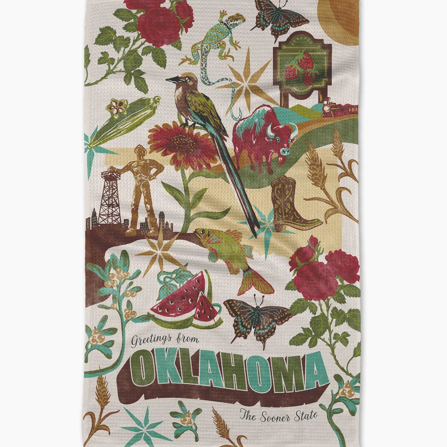 Decorative towel with Oklahoma-themed illustrations including a bird, flowers, and landmarks.