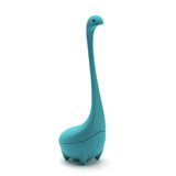 Turquoise Loch Ness monster-shaped tea infuser on a white background