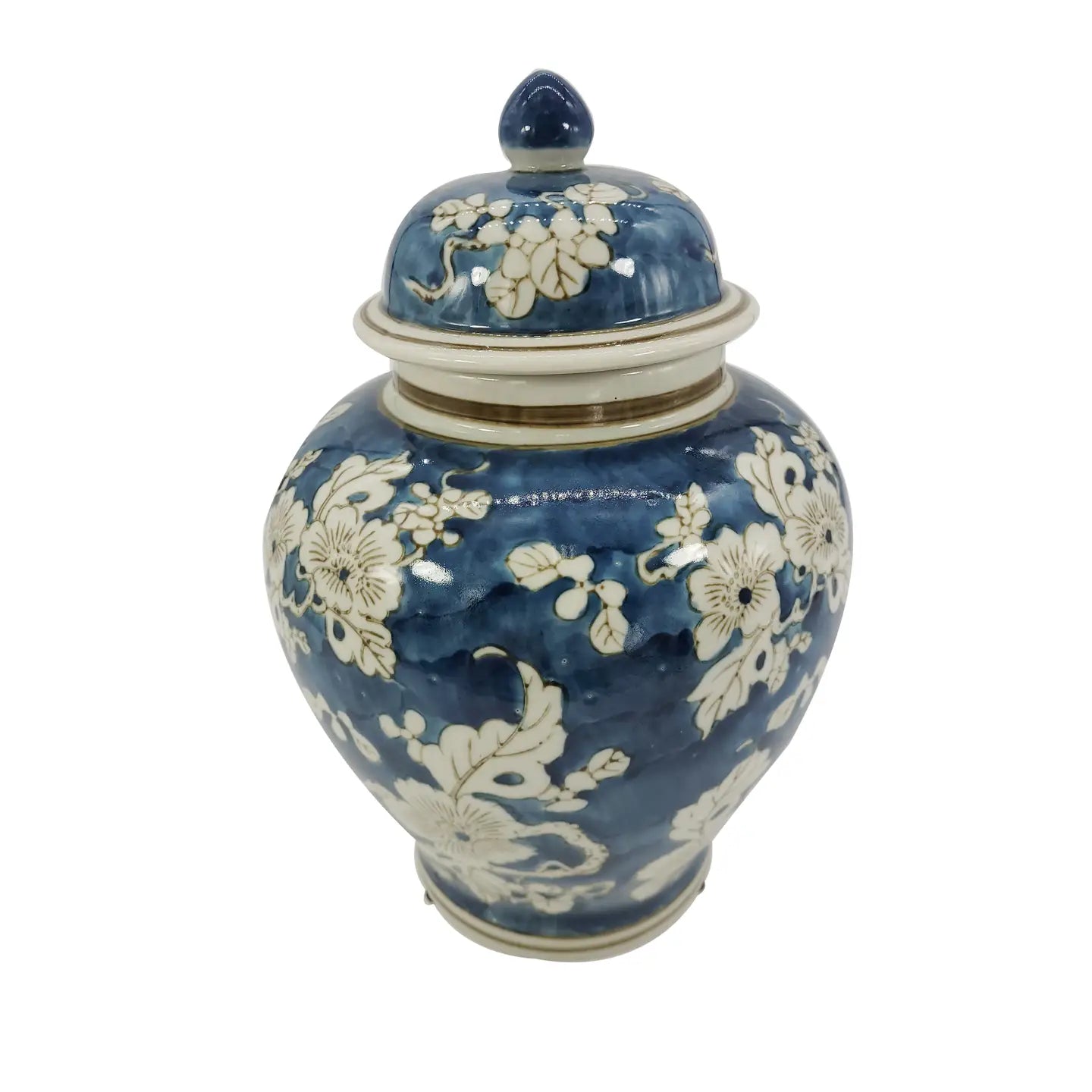 Blue ceramic jar with white floral patterns on a white background