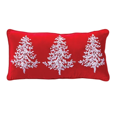 Red pillow with white embroidered trees on a white background