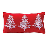 Red pillow with white embroidered trees on a white background