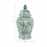 Green and white ceramic jar with lid on a white background
