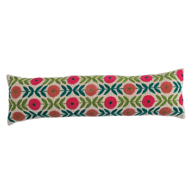 Decorative pillow with floral pattern on a white background