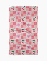 Checkered towel with cherry and flower pattern on a white background