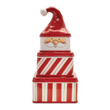 Stack of red and white striped boxes with a Santa hat on a white background