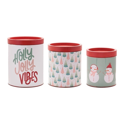 Three Christmas-themed tins with different designs on a white background